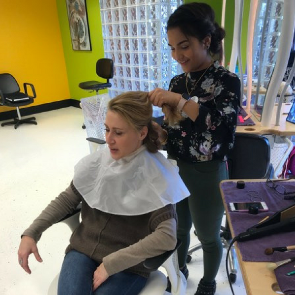 student performing hair services