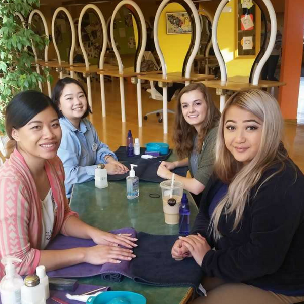 students performing manicures
