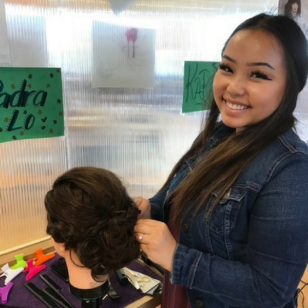 student working on practice hair