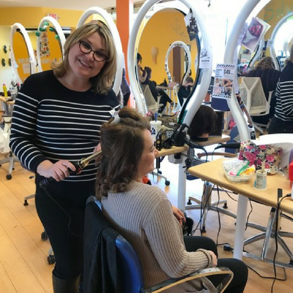 student performing hair services