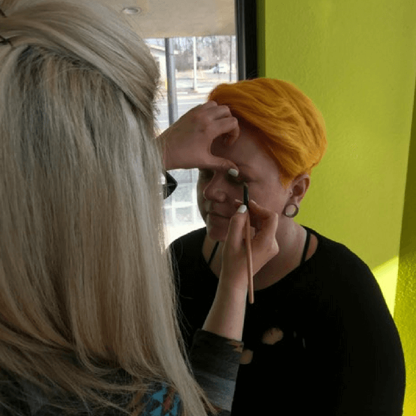Student Practicing Makeup student applying makeup