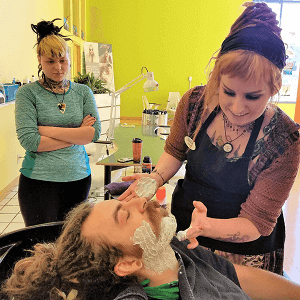 Beauty School Student Shaving Client students performing shaving services