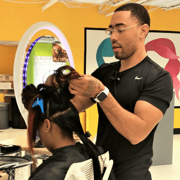 Student Performing Haircut student cutting hair