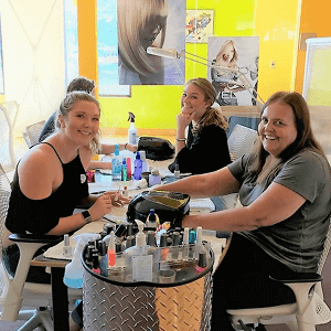 Students Performing Manicures students practicing manicures